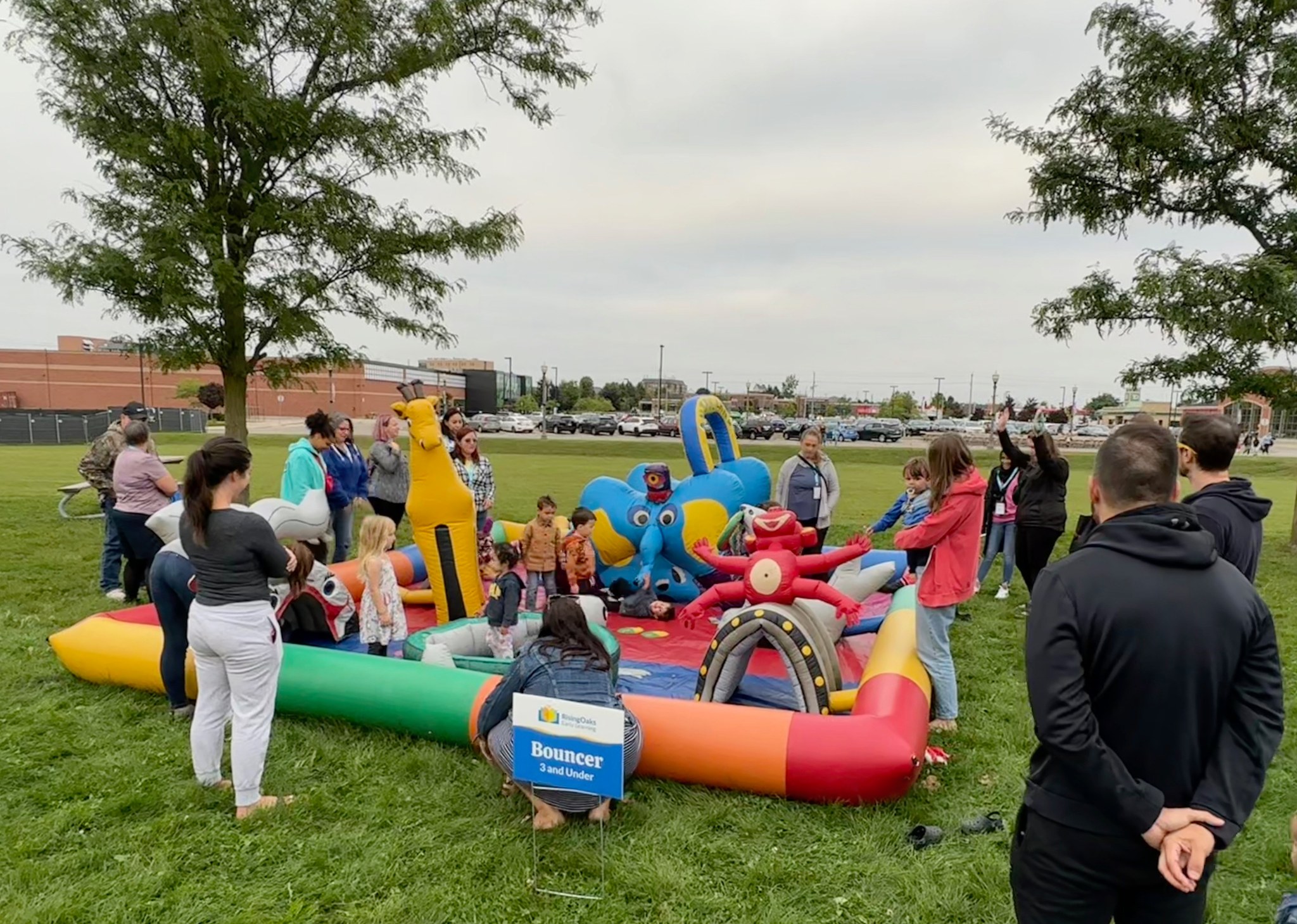 small children playing in inflatable bouncer are