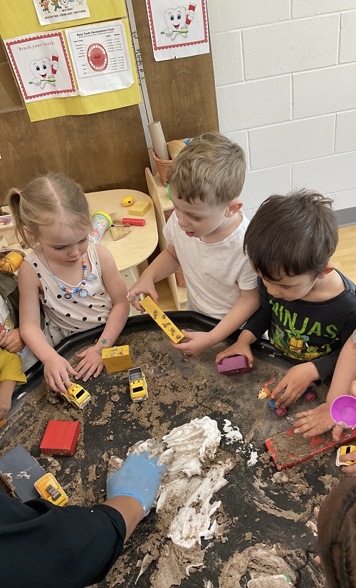 children playing at the tuff tray