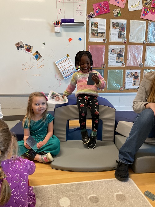 child sitting with mirrow