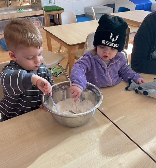 two children mixing