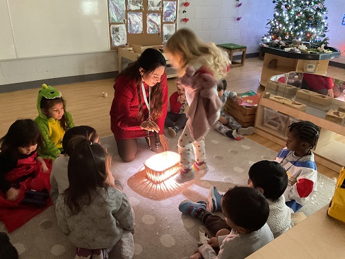 children gathering at the carput with the light