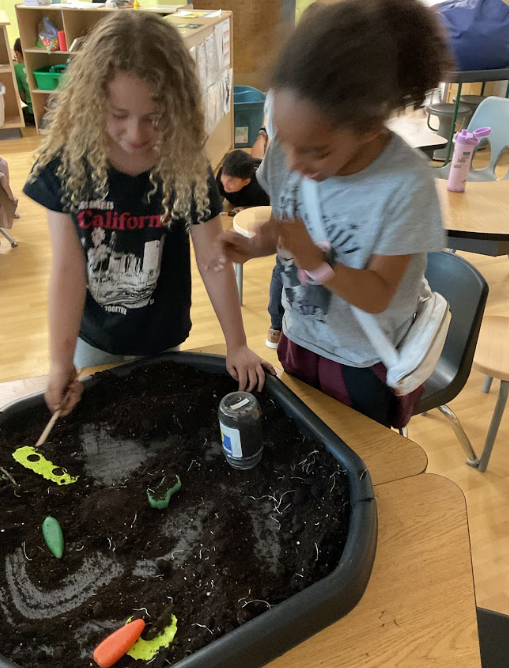 2 girls gardening